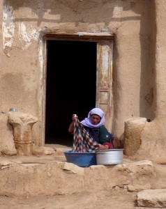 village-woman-washing-at-door